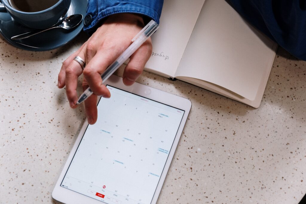 Photo by cottonbro studio: https://www.pexels.com/photo/person-holding-pen-and-using-a-tablet-5053742/